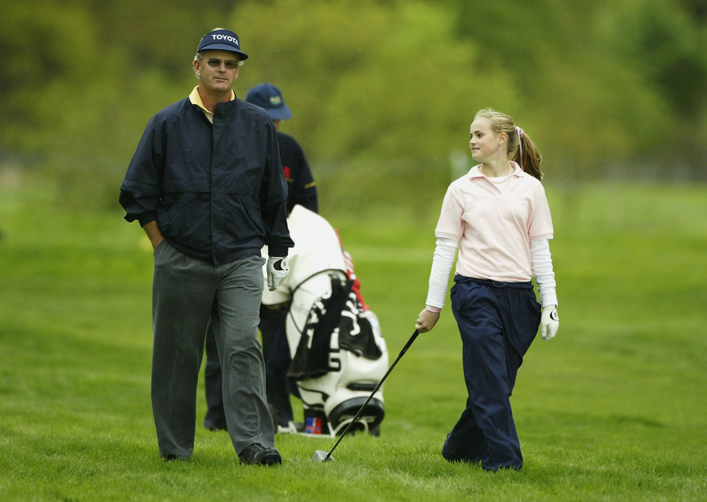 COVENTRY, ENGLAND - MAY 5:  11 year-old amateur Carly Booth of Scotland walks with fellow Scotsman and two time major champion Sandy Lyle on the ninth hole during the Pro-Am event prior to the Daily Telegraph Damovo British Masters on the Eden course at the Forest of Arden on May 5, 2004 near Coventry, England.  (Photo by Warren Little/Getty Images)