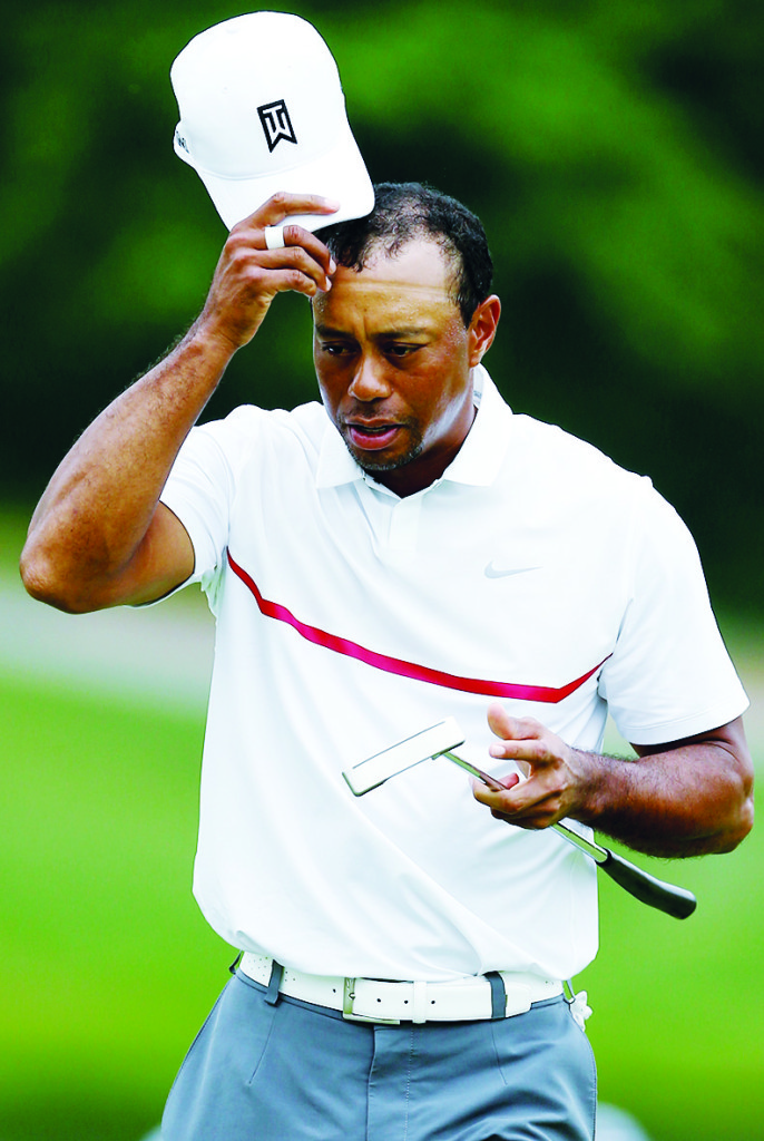 Tiger Woods walks off the green on the 18th hole during the third round of The Memorial Tournament at Muirfield (Photo by Andy Lyons/Getty Images)