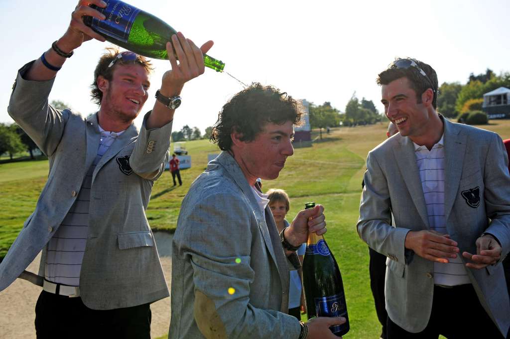 Taste for it: Chris Wood, left, celebrates a win for GB&I with Rory McIlroy and Ross Fisher, but is targeting a more high-profile victory at Hazeltine in 2016 (Photo by Stuart Franklin/Getty Images)