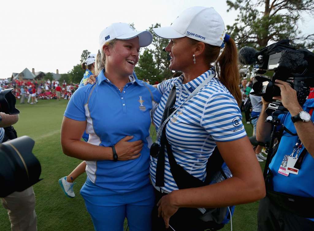 Happy Swedes: Caroline Hedwall celebrates with assistant captain Sophie Gustafson after winning the point that retained the Solheim Cup for Europe (Photo by Andy Lyons/Getty Images)