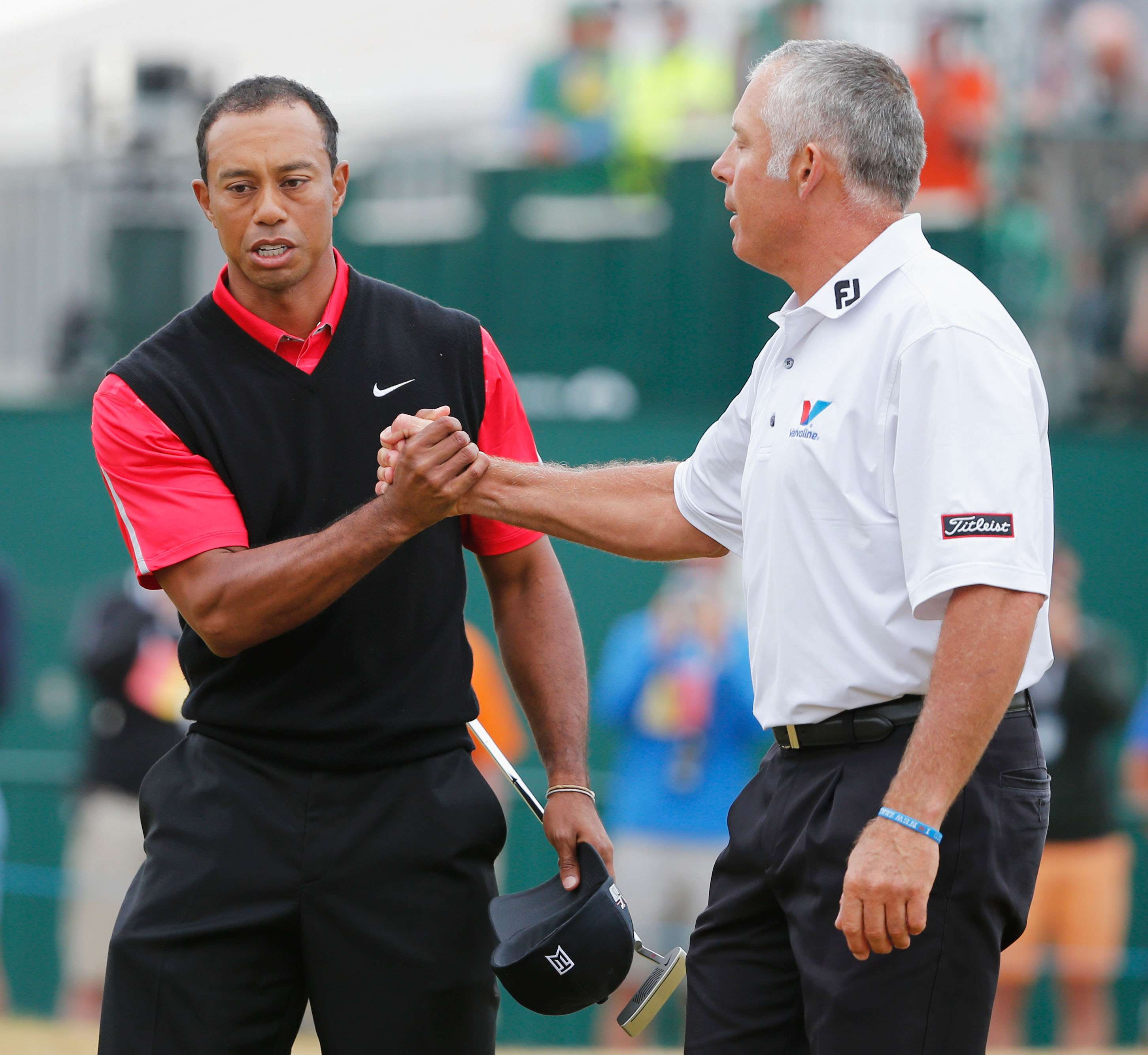 Frosty relationship: Tiger Woods and Steve Williams shake hands after the 2013 Open Championship at Muirfield (Photo by Rob Carr/Getty Images)