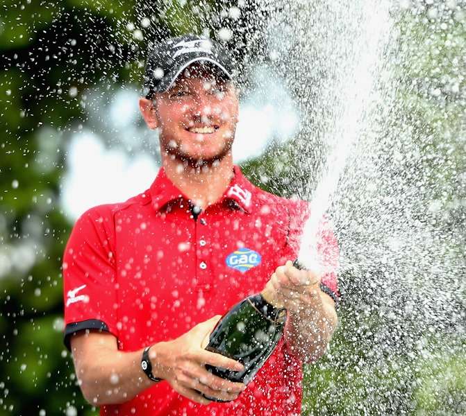 Champagne moment: Chris Wood celebrates victory at Wentworth (photo by Getty Images)