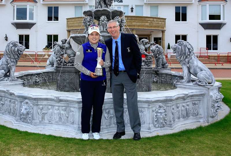 Great honour: Inbee Park, of South Korea, shows off the Women's British Open trophy with Ricky Hall, the director of golf at Turnberry (photo by Getty Images)