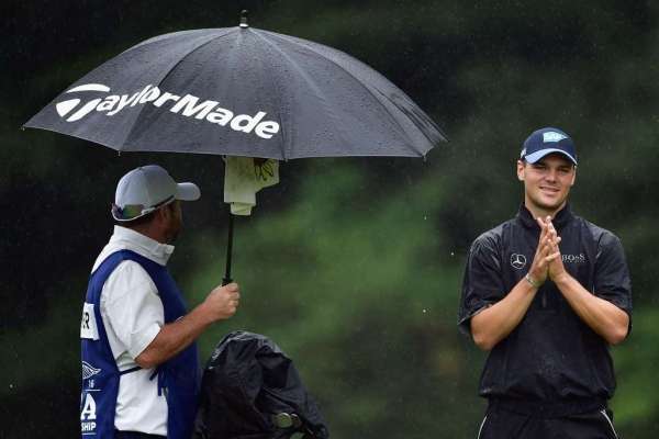 Rain sets up marathon Sunday in final Major