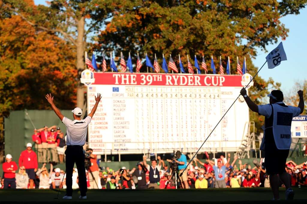 Done it: German Martin Kaymer raises his arms after sinking the putt to win the 2012 Ryder Cup, while his caddy Craig Connelly watches with jubilation (Photo by Getty Images)