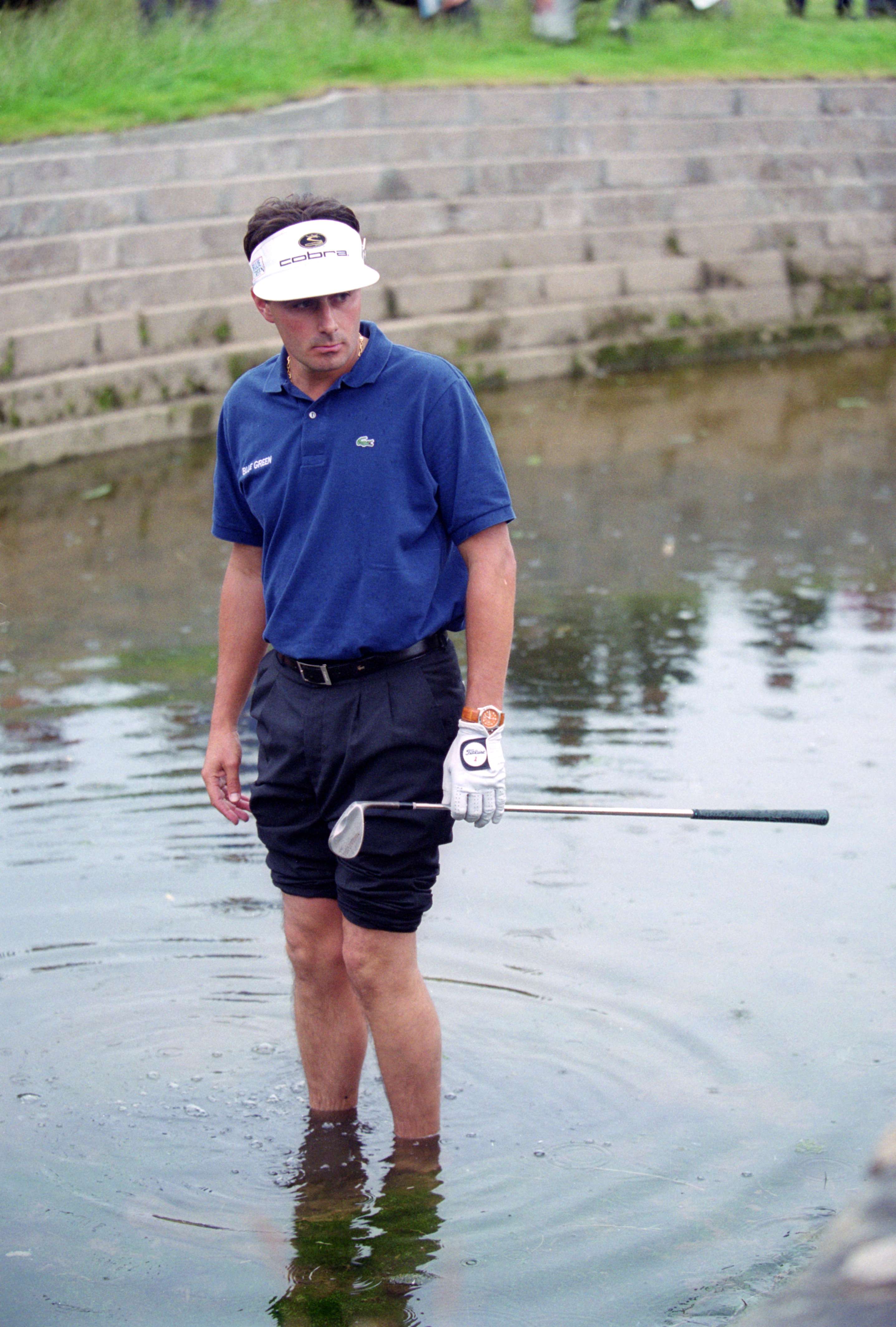 French golfer Jean Van de Velde wades into Barry Burn by the 18th green after his 3rd shot went astray in the final round of the British Open Championship at Carnoustie, Scotland, 18th July 1999. Having arrived at the 18th tee with a three-shot lead, Van de Velde narrowly lost the championship to Paul Lawrie. (Photo by Ross Kinnaird/Getty Images)